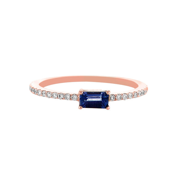 Purple sideway emerald cut sapphire with a pavé band