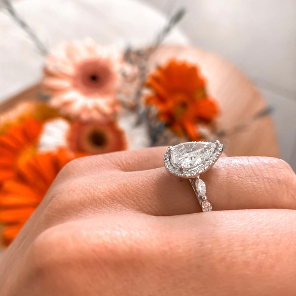 Pear cut with a Diamond Halo and Marquises Band