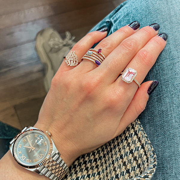 Purple sideway emerald cut sapphire with a pavé band